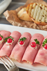 Ham roll ups stuffed with cheese, garlic and mayonnaise