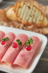 Ham roll ups stuffed with cheese, garlic and mayonnaise