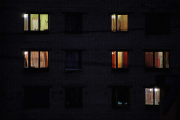 lighted night windows of houses