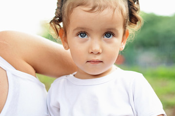 Portrait of baby girl in park.