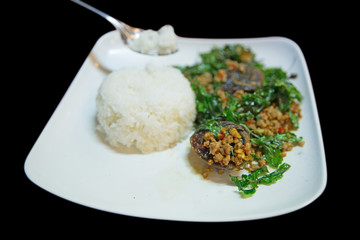 Stir Fried preserved egg crispy basil with rice