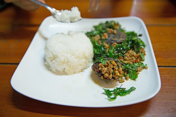 Stir Fried preserved egg crispy basil with rice