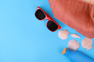 Top view of sunglasses, shells and starfish