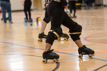 Roller derby players compete against each other