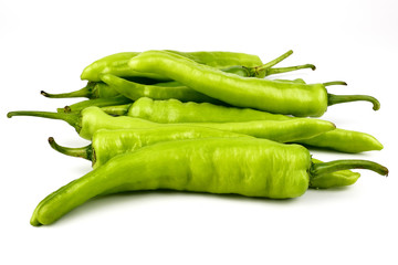 fresh green banana peppers or sweet peppers (capsicum annuum) isolated on a white background