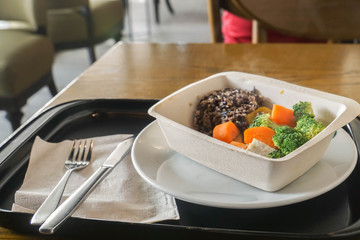 clean food of quinoa and boil carrot and broccoli in box