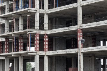 Fototapeta na wymiar concrete frame building on abandoned construction site. urban background