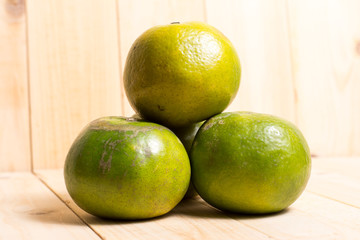 Orange fruit on wooden background