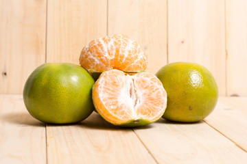 Orange fruit on wooden background