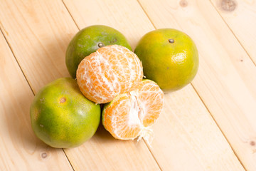 Orange fruit on wooden background