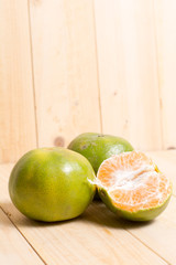 Orange fruit on wooden background