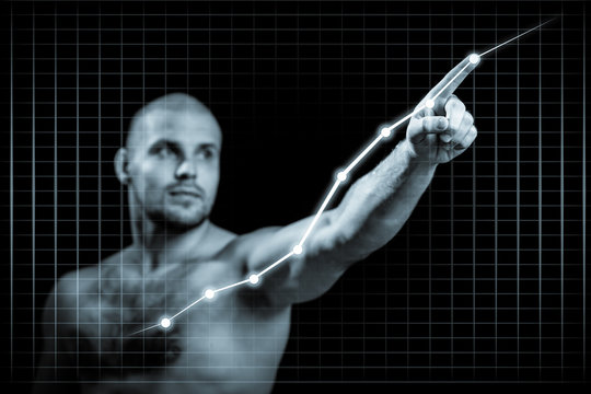 Young man in growth concept with a graph.Serious man drawing strategy on virtual screen on dlack isolated background