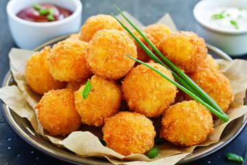 cheese balls with tomato sauce.