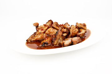 Assorted delicious Grilled pork and spicy sauce on a white plate isolated on white background