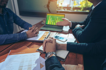 businessman showing good statistics report explaining deal advantages convincing multiracial...