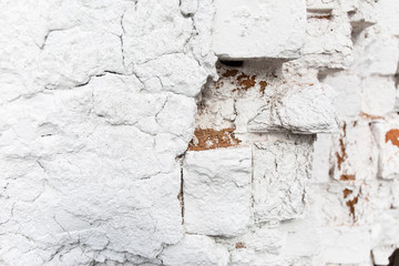 Old weathered white plaster wall texture. Grunge background.