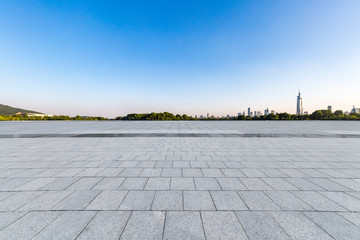 Panoramic skyline and modern business office buildings with empty road,empty concrete square floor