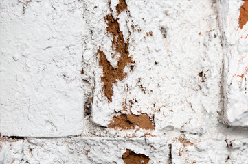 Old weathered white plaster wall texture. Grunge background.