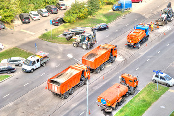Municipal services repair asphalt on the road