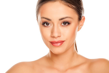Portrait of young beautiful woman with makeup on white background