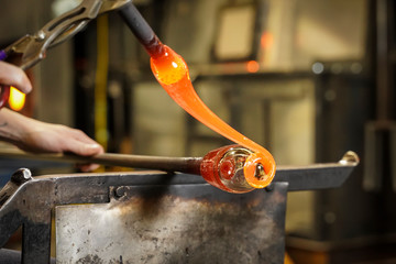 Molten Glass Being Shaped into Art by a Glass Blower