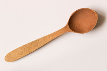 Old wooden spoon. Isolated on white background