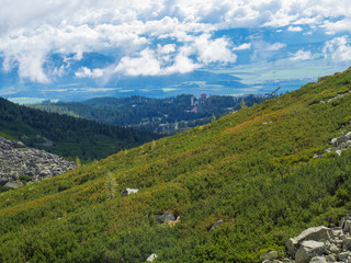 Fototapeta na wymiar Valley Mlynska Dolina in slovakia mountains with Panoramic view on Strbske pleso village and green slope, High Tatra Mountains, Slovakia, summer