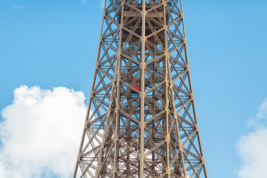 Paris, France .The main elevator in the inside of the Eiffel tower. One of the unusual Eiffel Tower lifts that take passengers to the viewing platforms. They are located on the legs of the tower and