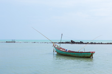 Naklejka na ściany i meble Fishing boat on the beach