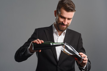 Man filling glass with beer