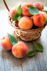 Naklejka na ściany i meble peach fruits on wooden table