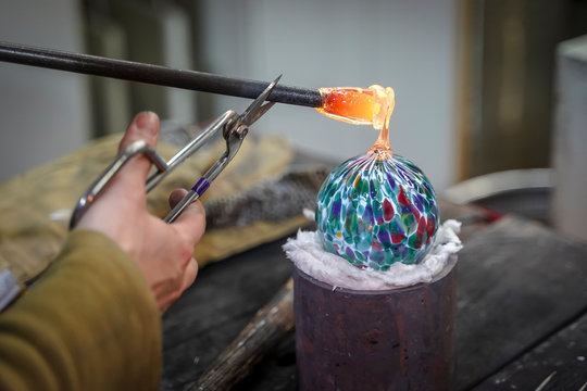 A Beautiful Glass Ball Being Made by a Glass Blower