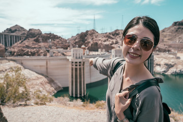 young girl pointing finger to the building