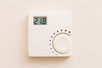 White thermostat on wall.