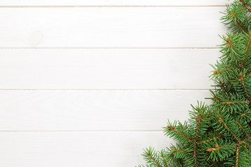 Christmas wooden background with fir tree. Top view with copy space for your text