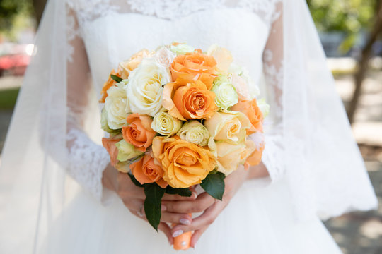 Bride holding her bouquet, closeup