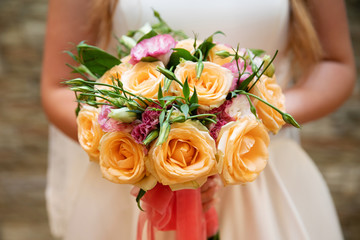 Bride holding her bouquet, closeup