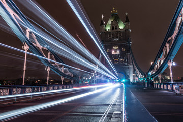 Fototapeta na wymiar An Iconic Photo Of Tower Bridge In London, The Light Trails Of A Bus Fill The Image