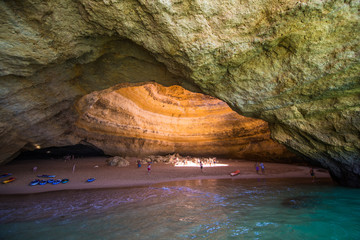 Benagil, Portugal - Juny, 2018: Benagil Cave Boat Tour inside Algar de Benagil, cave listed in the world's top 10 best caves. Algarve coast near Lagoa, Portugal. Tourists visit a popular landmark