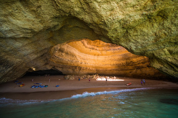 Benagil, Portugal - Juny, 2018: Benagil Cave Boat Tour inside Algar de Benagil, cave listed in the world's top 10 best caves. Algarve coast near Lagoa, Portugal. Tourists visit a popular landmark © F8  \ Suport Ukraine