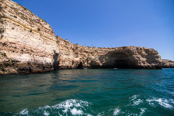Rocks, cliffs and ocean landscape at coast in AAlgarve, Portugal view from boat