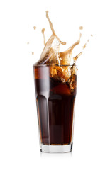 A glass of cold cola with a splash of ice cubes