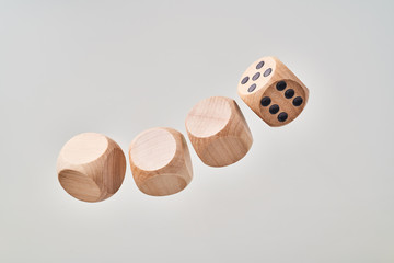 Abstract floating wooden dice on white background
