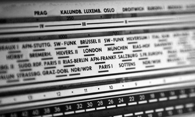 Vintage retro analog radio display with FM and AM band, European cities.