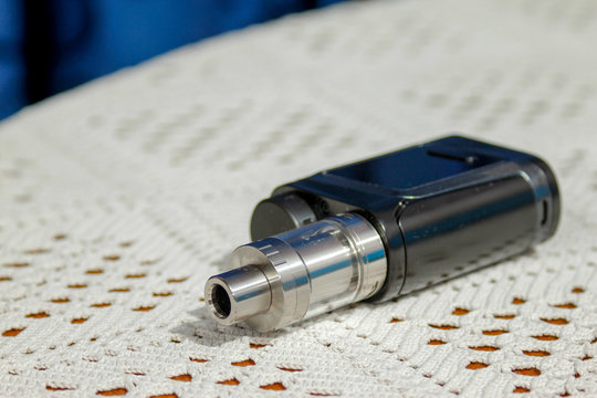 Electronic cigarette, electronic pipe, personal vaporizer, vaping device. e-pipe with blurred background