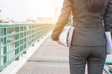 Hat engineer female in hand