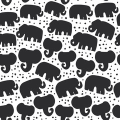 Beautiful seamless pattern Indian Elephant with polka dot ornaments. Hand drawn ethnic tribal decorated animals. black contour isolated on white endless background. Vector