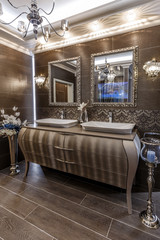Interior of bathroom with double sink basin faucet