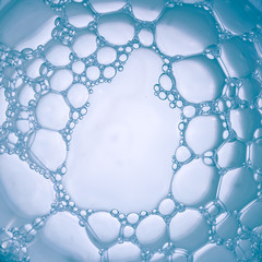 Macro close up of bubbles in glass of water. Scientific, cell membrane