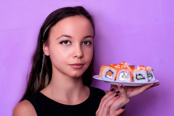 woman eating sushi